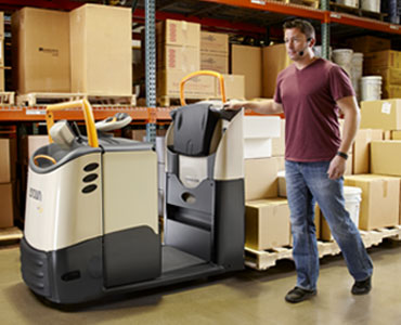 Operator using pick position controls to walk alongside GPC order picker forklift