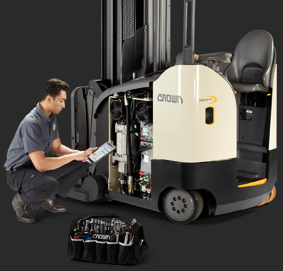 Crown service technician performs maintenance on Crown narrow aisle reach truck